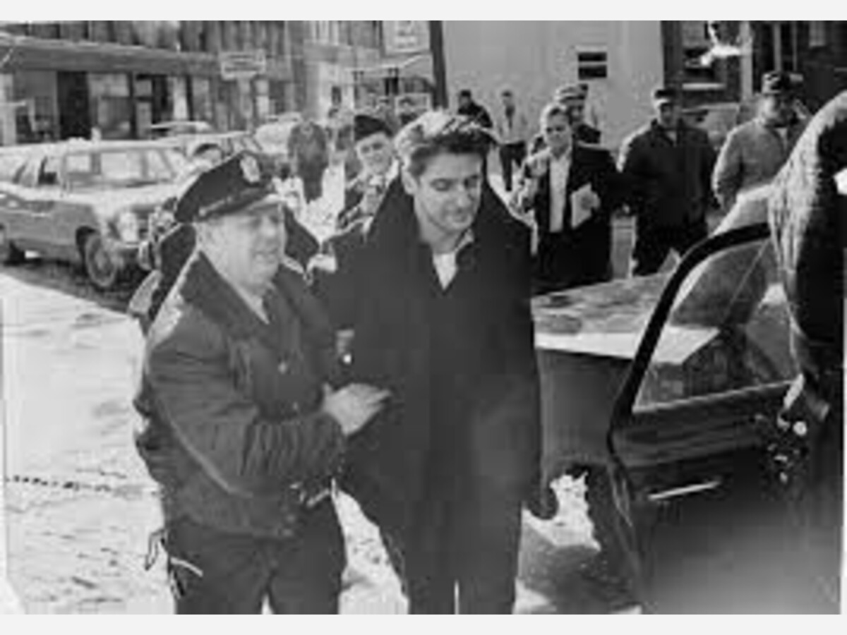 A police officer escorts a handcuffed Albert DeSalvo in February 1967.