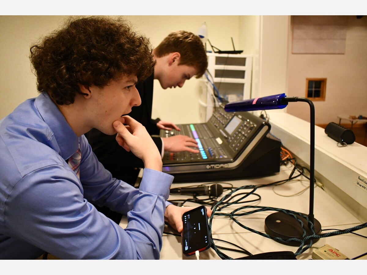 ﻿Film Director Jack Veo, 17, and Co-Director Jack Ricca, 17, inside the technology booth at Hopkinton Center for the Arts, Hopkinton, Massachusetts for local movie premiere. (Image by MHS Sophomore Connor Wong. Date 2023 January 27.)