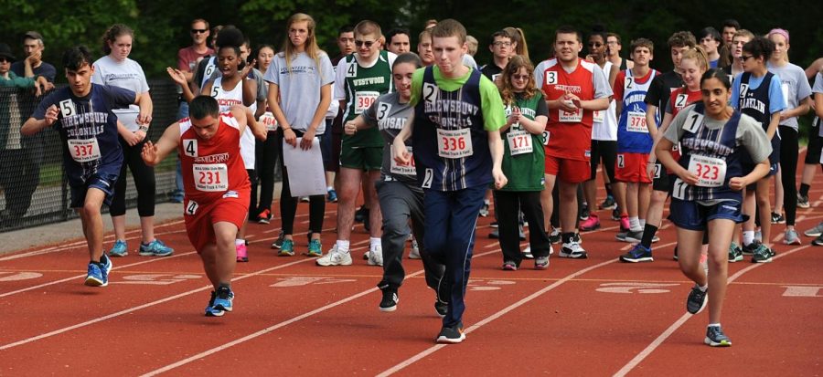 Students from different high schools take part in a unified track and field race at Milford High School 